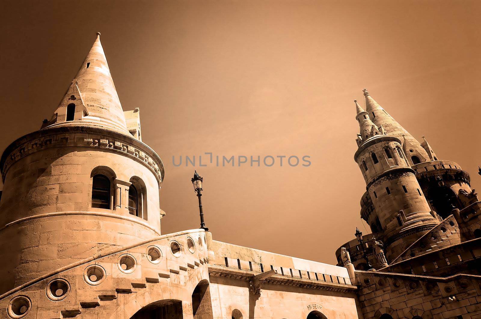 The great tower of Fishermen's Bastion on the castle hill of Budapest in sepia