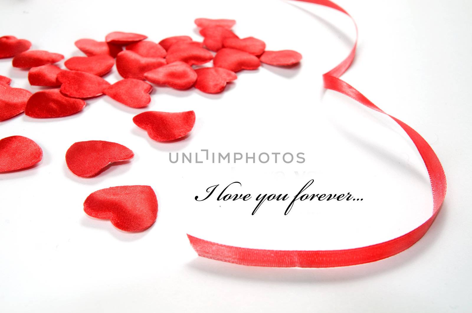 Love background. Small hearts and ribbon by photocreo