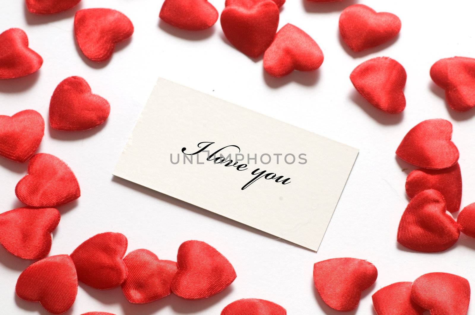 Love message surrounded by little hearts. Easy editable for your own text. Composition for themes like love, valentine's day, holidays.