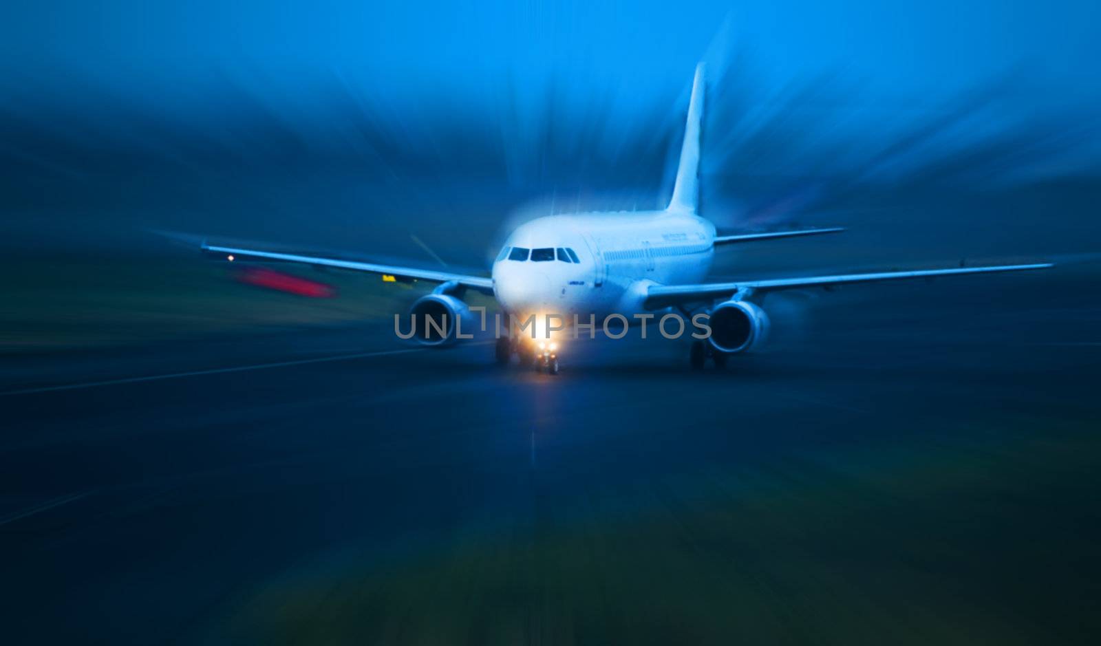 Plane takes of at dusk by photocreo