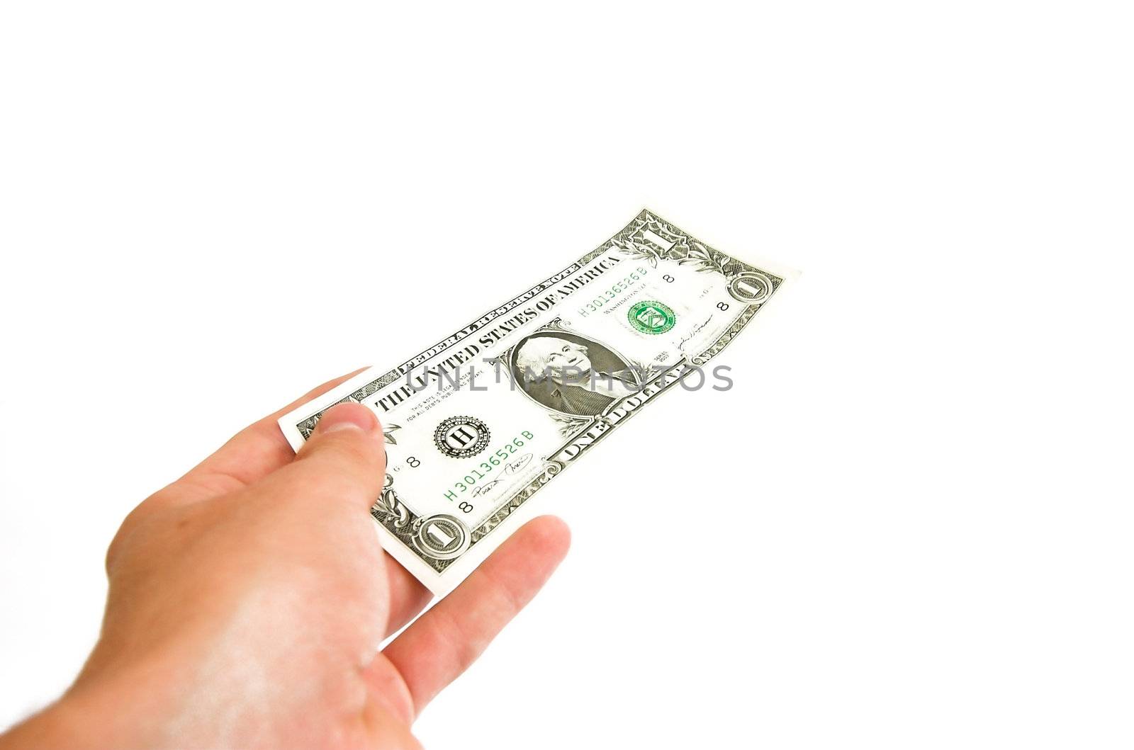 Hand giving away one dollar bill. Isolated on white