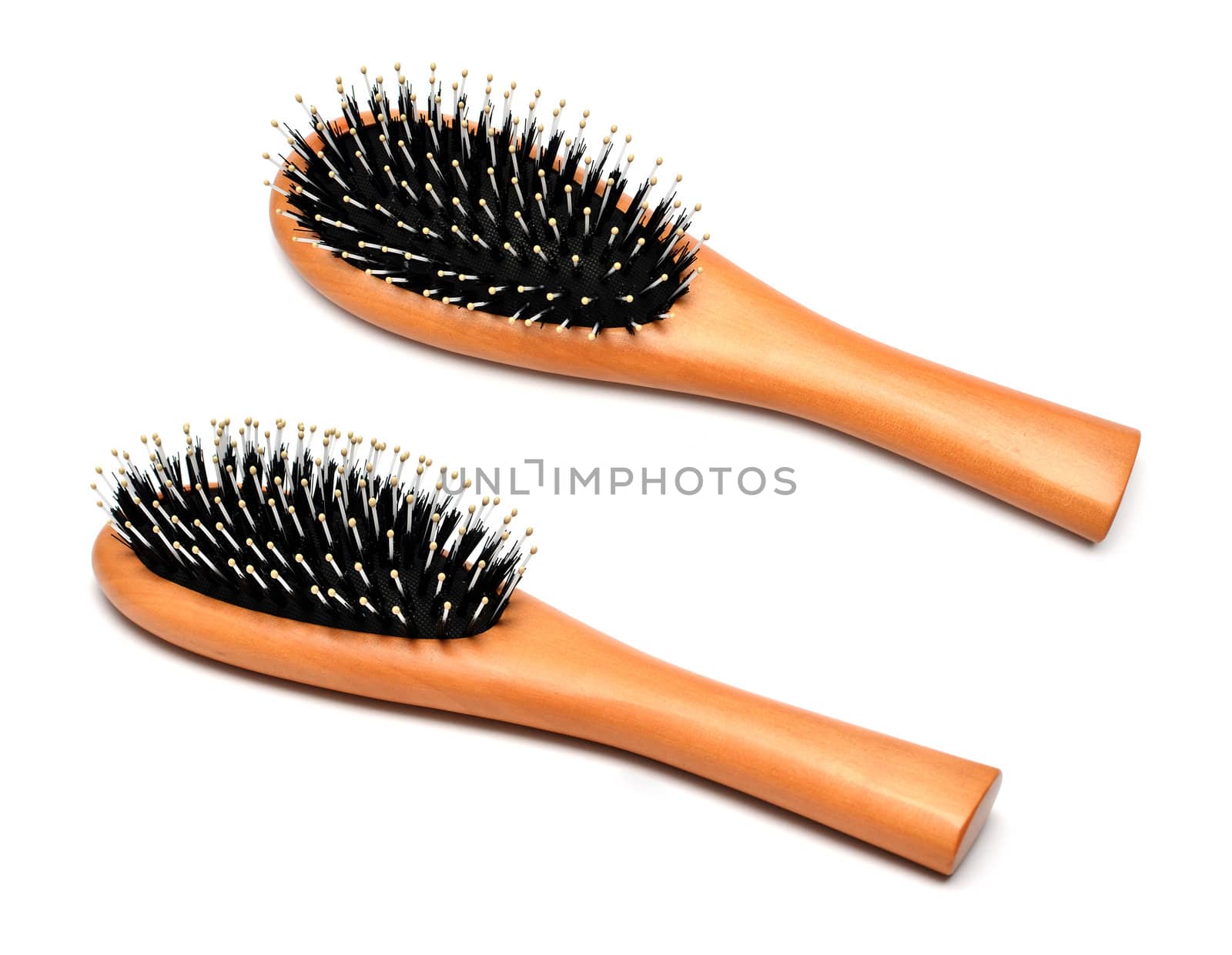 Wooden hairbrush isolated on white background by DNKSTUDIO