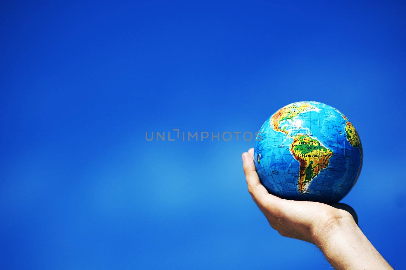 Earth globe in hand protected. Ideal for Earth protection concepts, recycling, world issues, enviroment themes