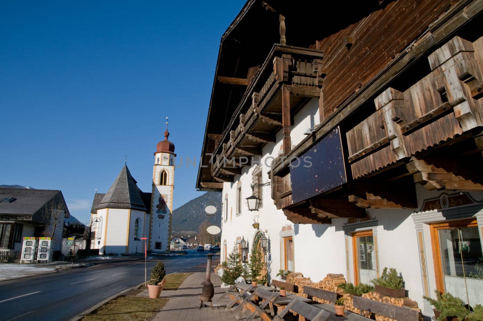 Mountain village in the Alps with traditional buildings