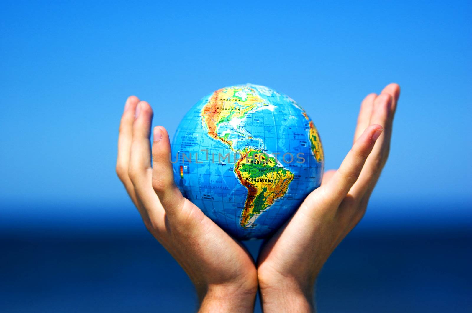 Earth globe in hands protected. Ideal for Earth protection concepts, recycling, world issues, enviroment themes