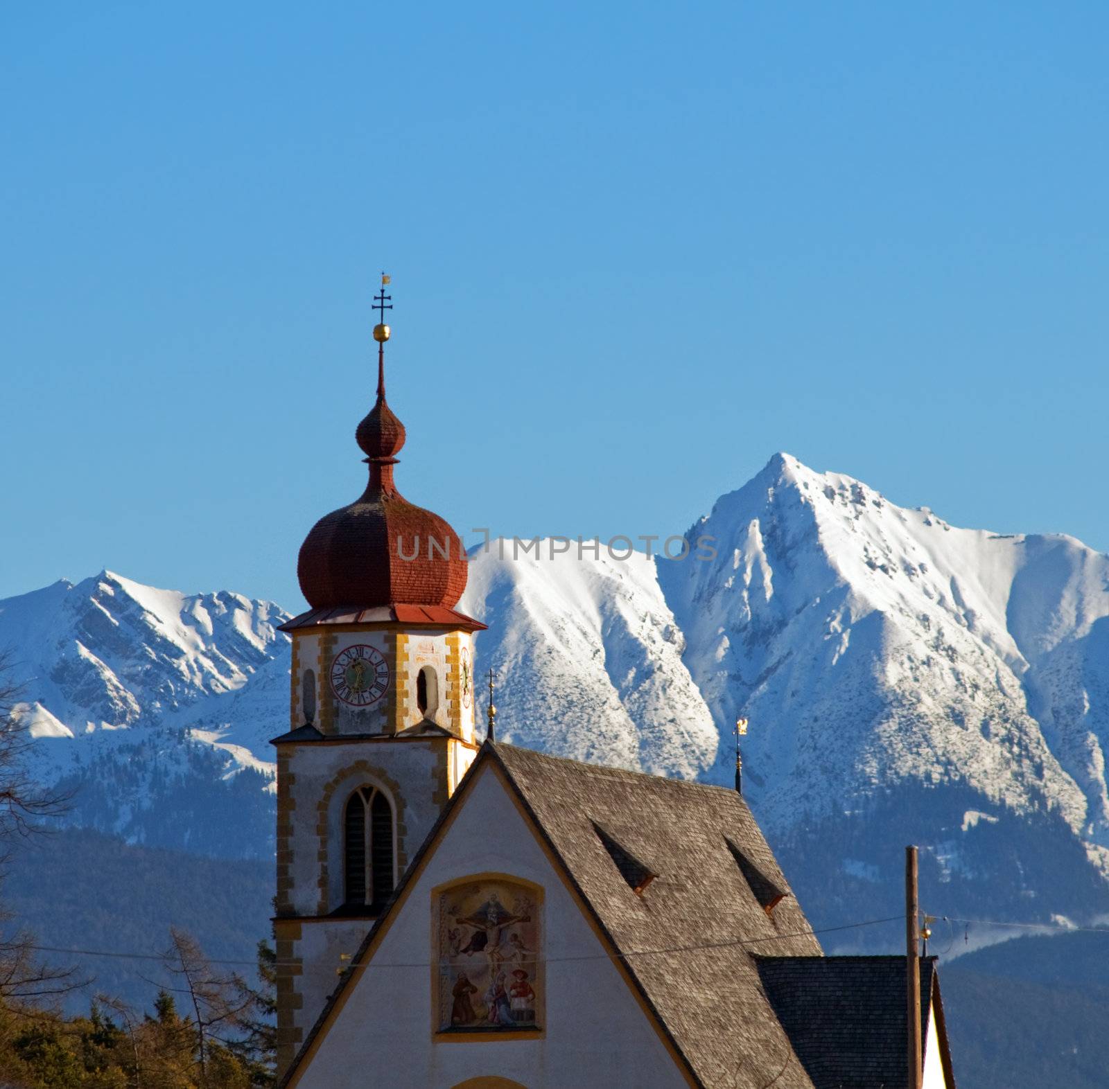 Church in alpine winter scenery