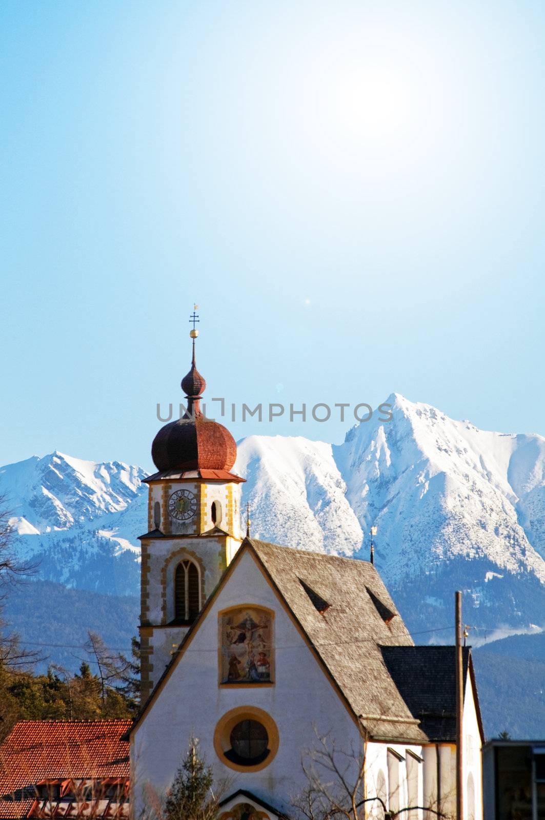 Church in alipine scenery by photocreo