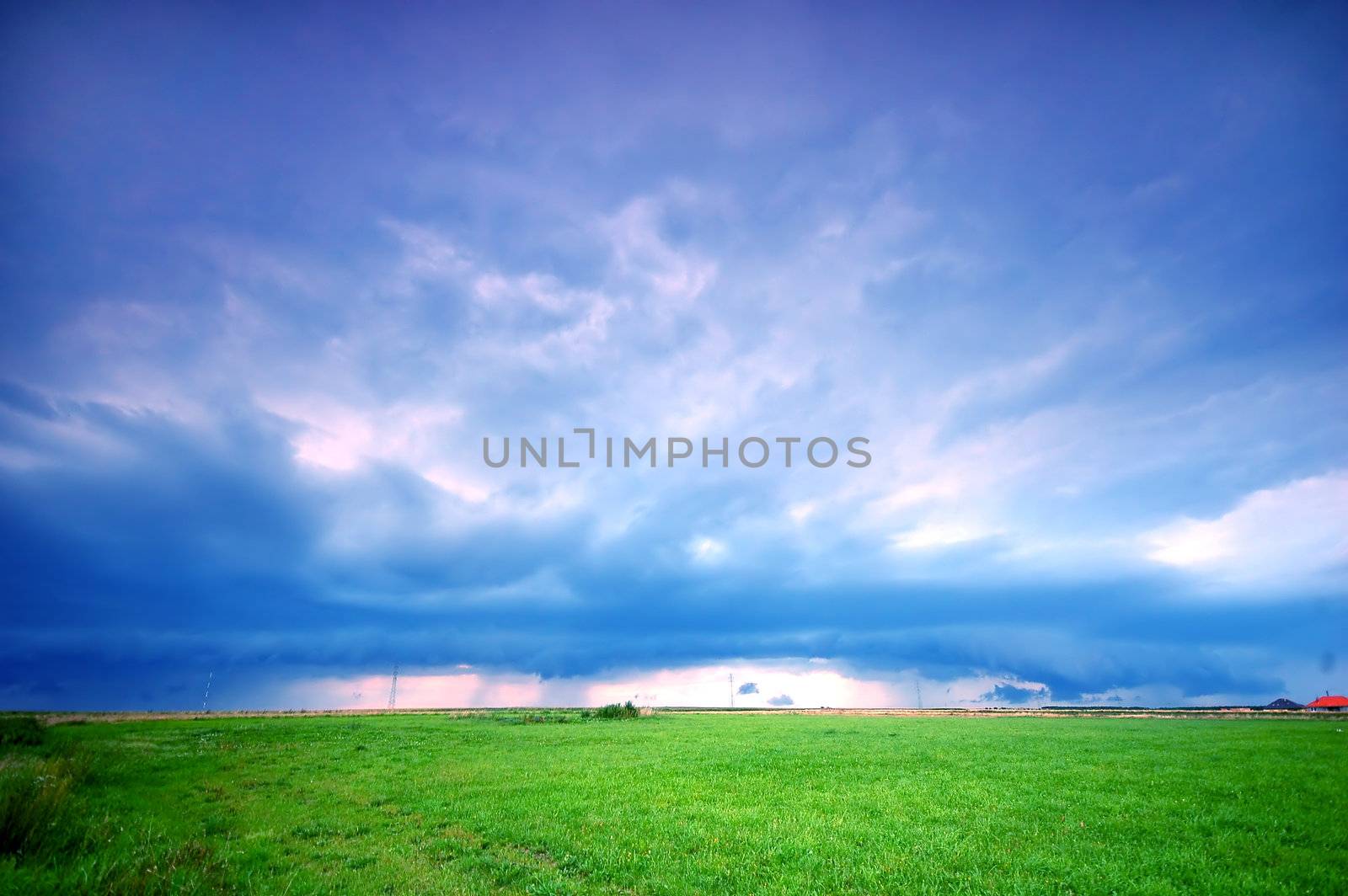 Grassland and stormy rainy sky. Ideal as a background