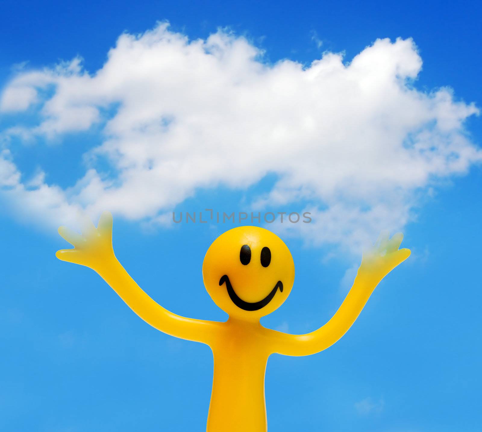 A happy face holding a white cloud. Conceptual, copyspace.