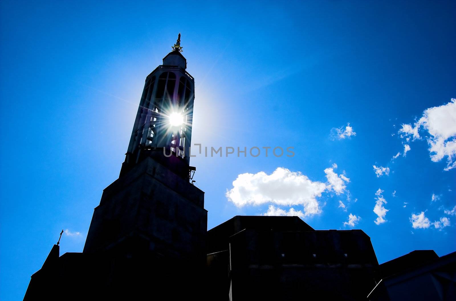 Sun shining through church tower