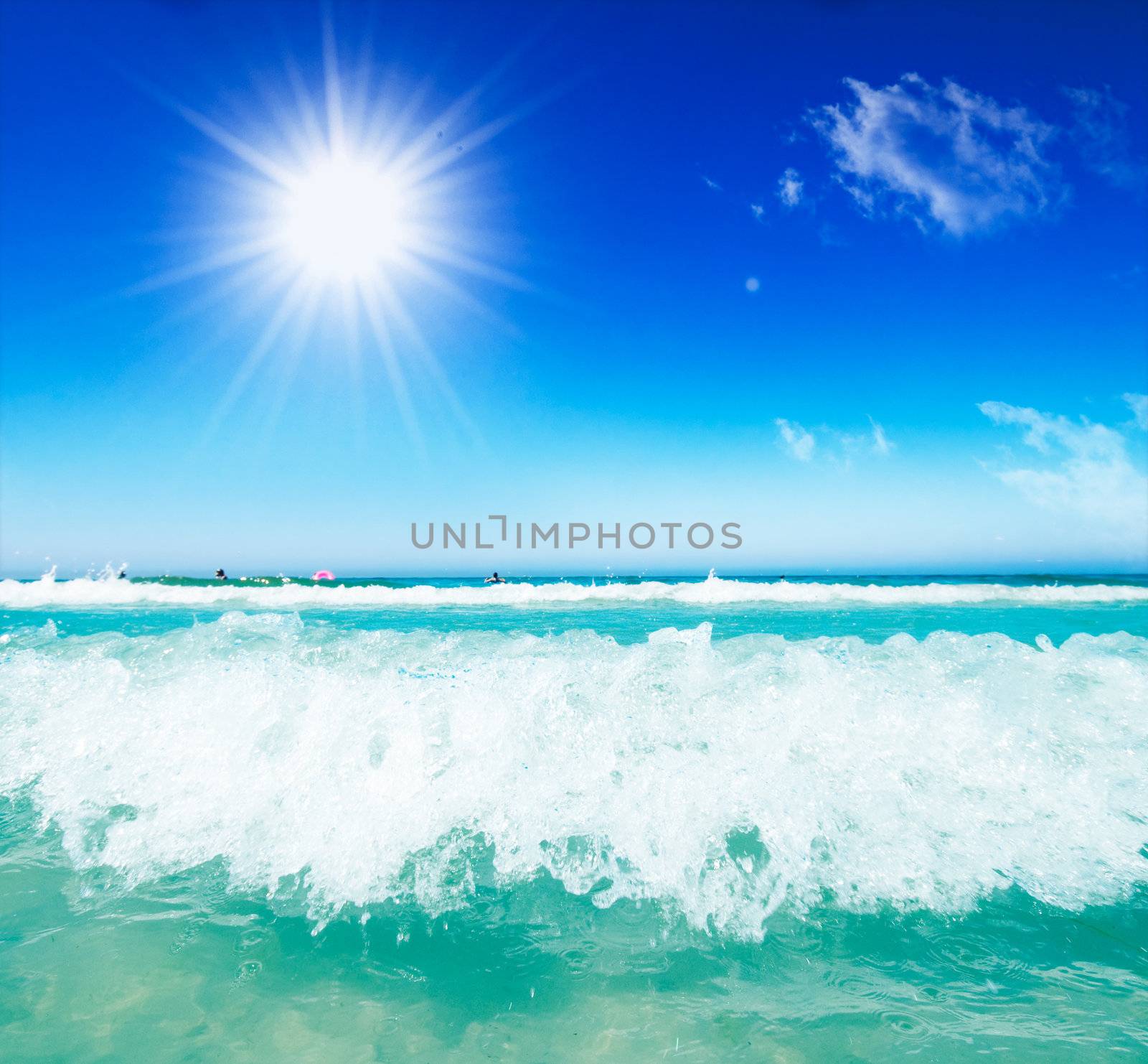 Sea waves and sunny blue sky