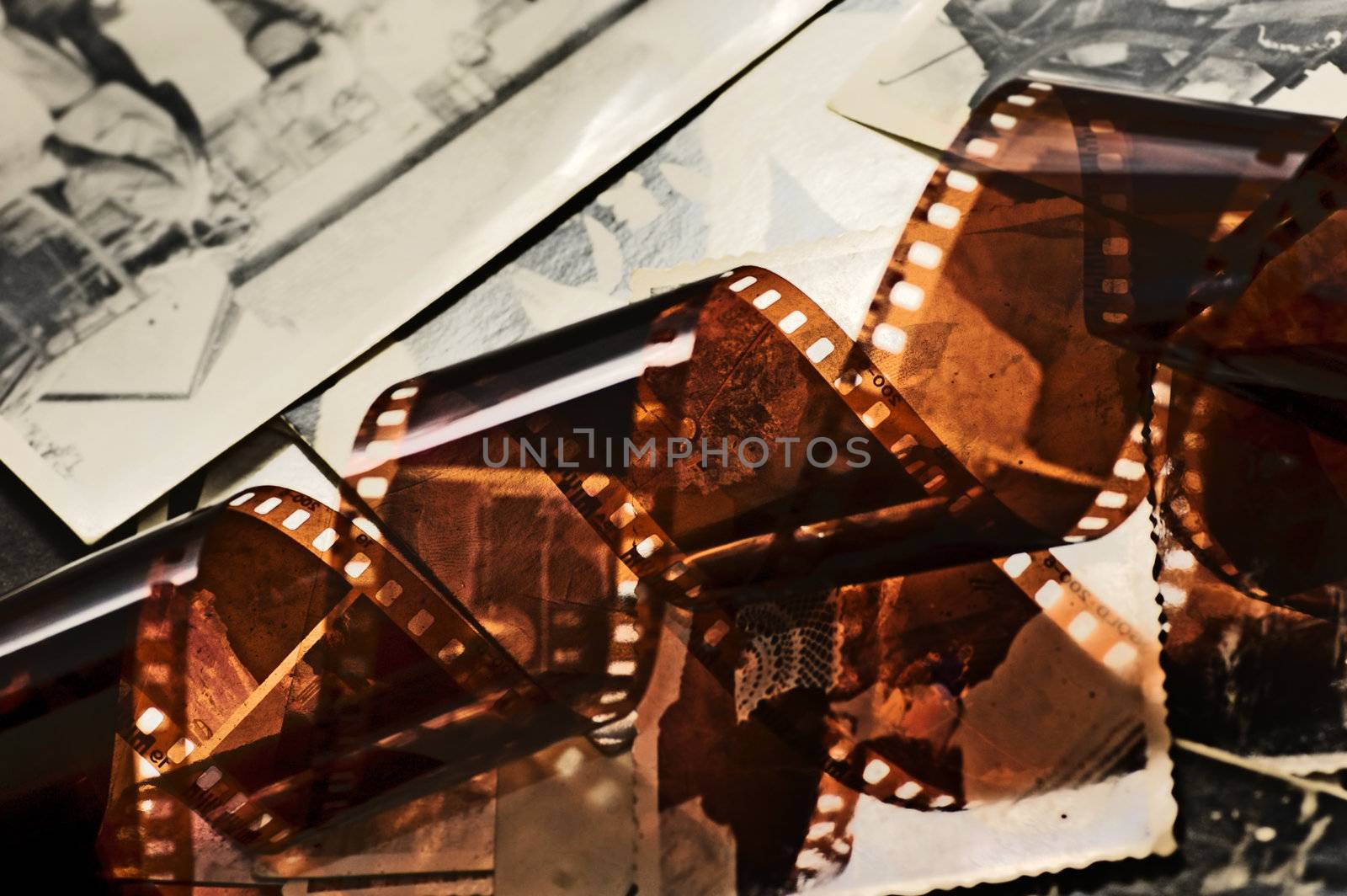 Old film strip and photos background by photocreo