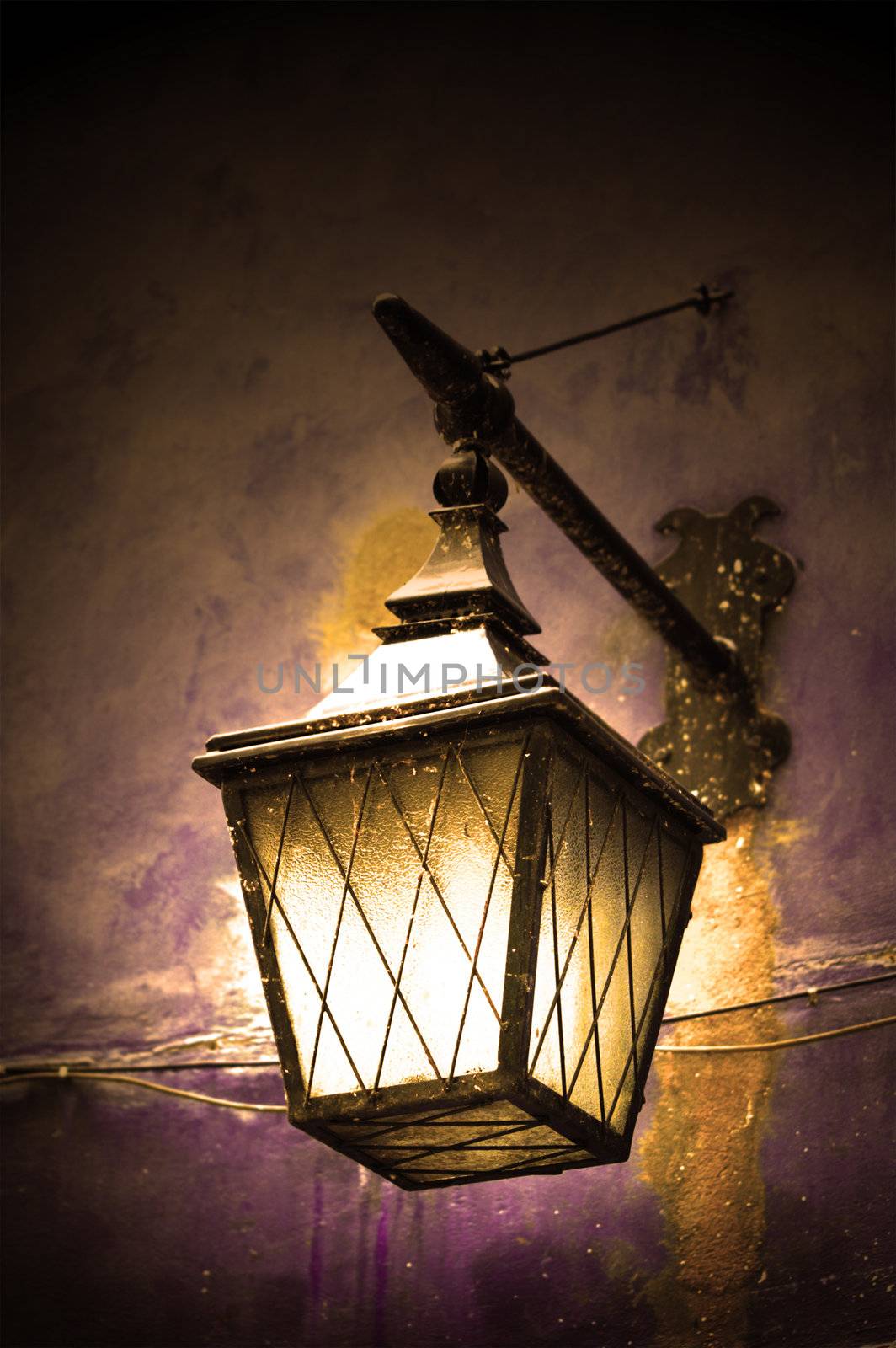 Street lamp shining by photocreo