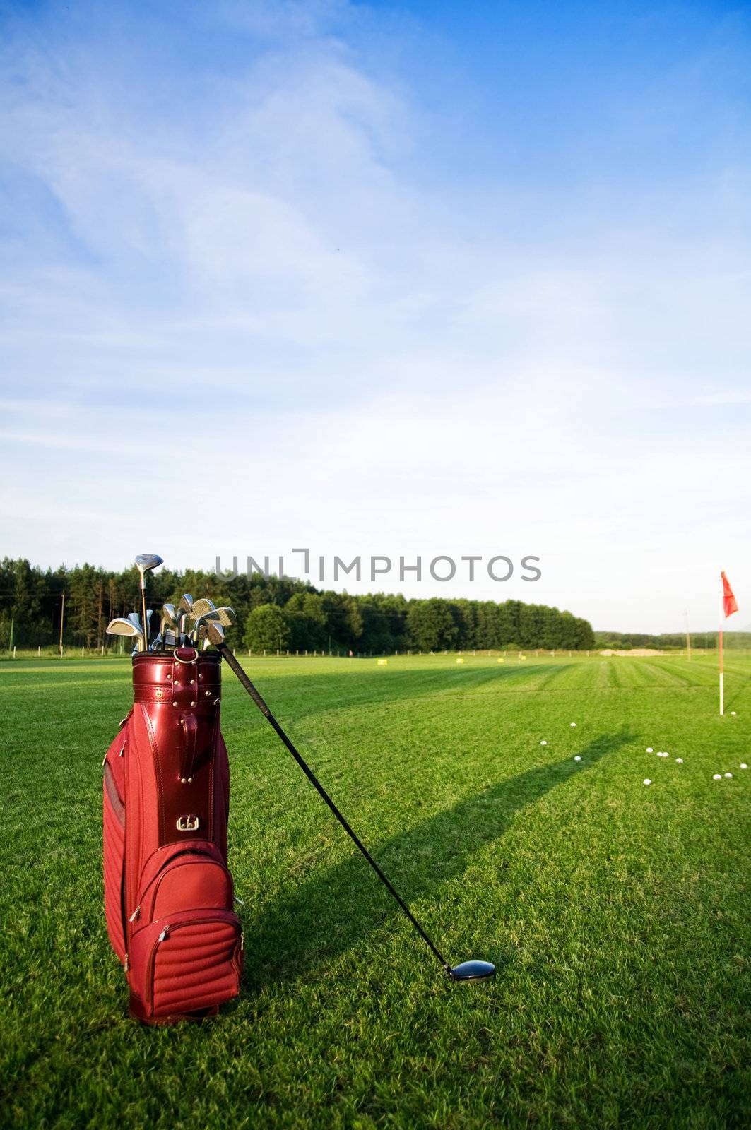 Golf gear on the golf field by photocreo