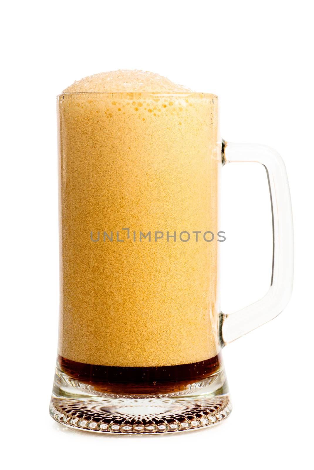 Dark beer with froth in a glass over white background