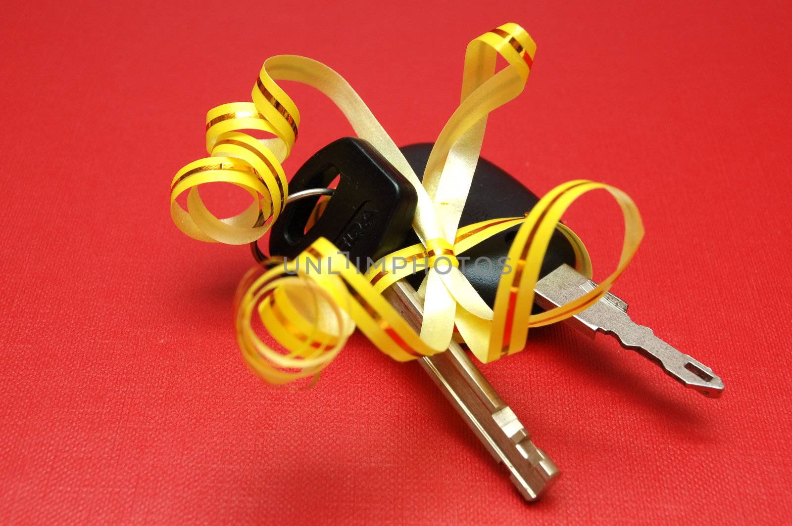 Car keys on red background