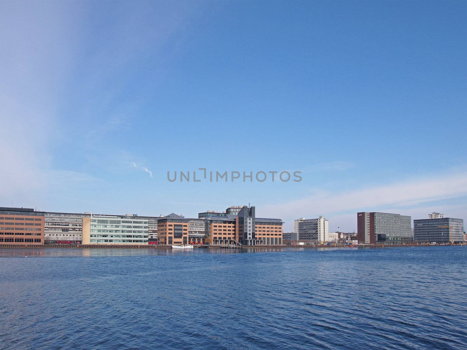COPENHAGEN - MAR 16: View of modern commercial and business buildings across the canal in Central Copenhagen, Denmark on March 16, 2013.
