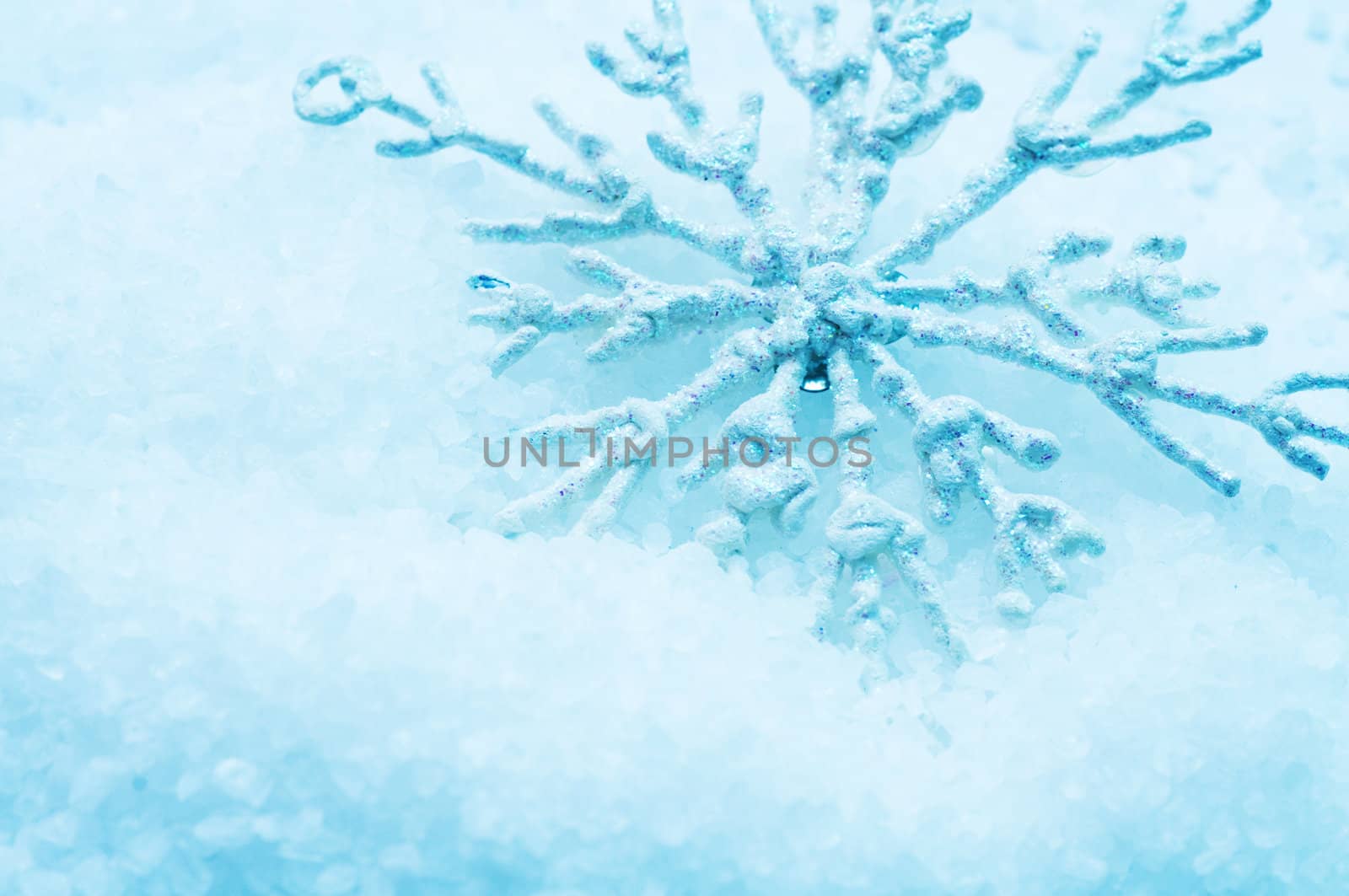 Frosty snowlake in snow Christmas decoration background