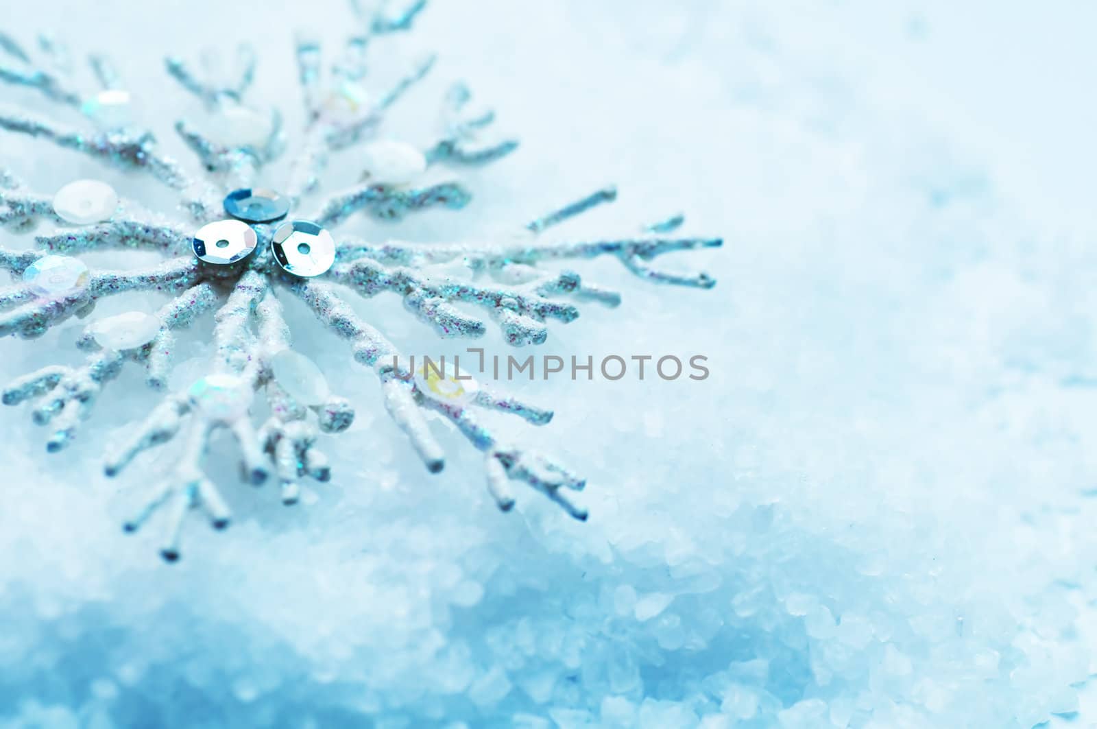 Frosty snowlake in snow Christmas decoration background