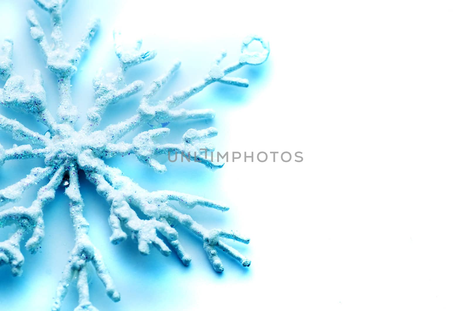 Frosty snowlake Christmas decoration on white background