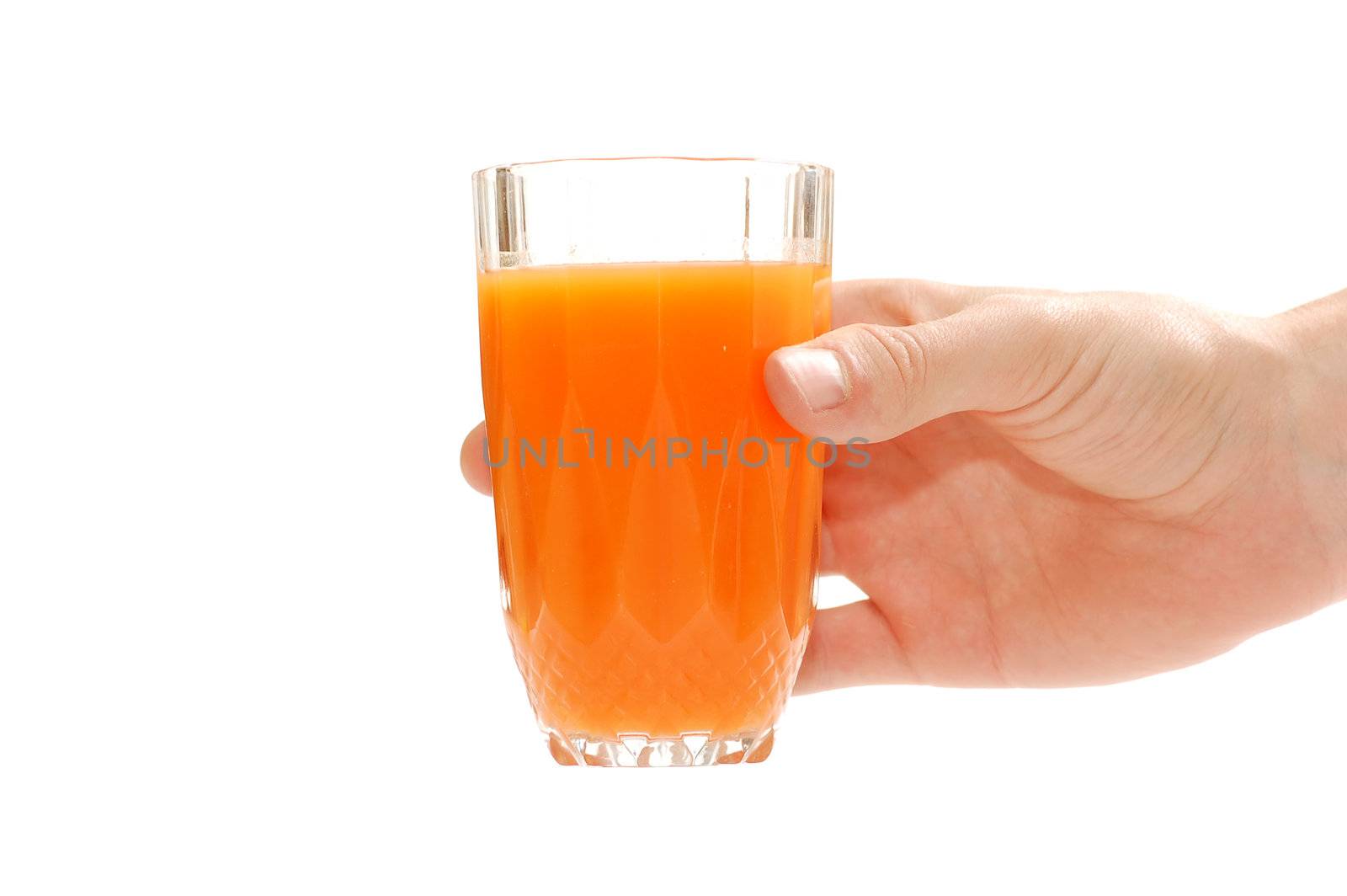 Hand holding a glass of fruit juice. Isolated on white