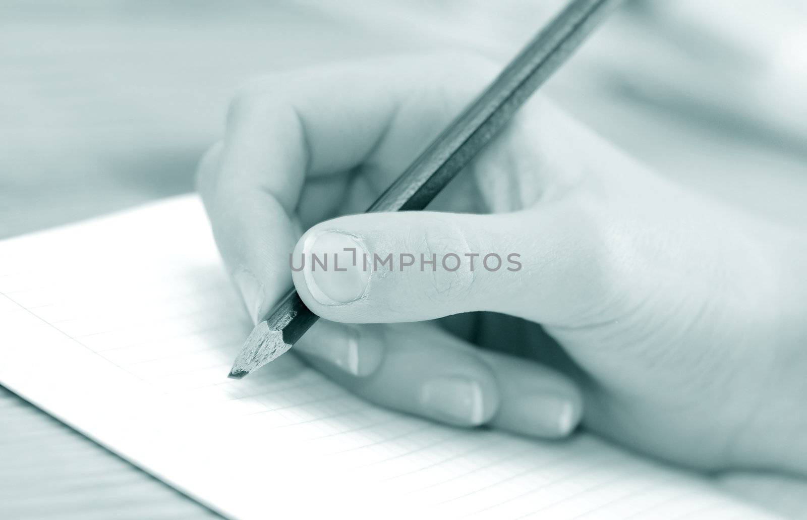 Close-up of child hand writing or drawing