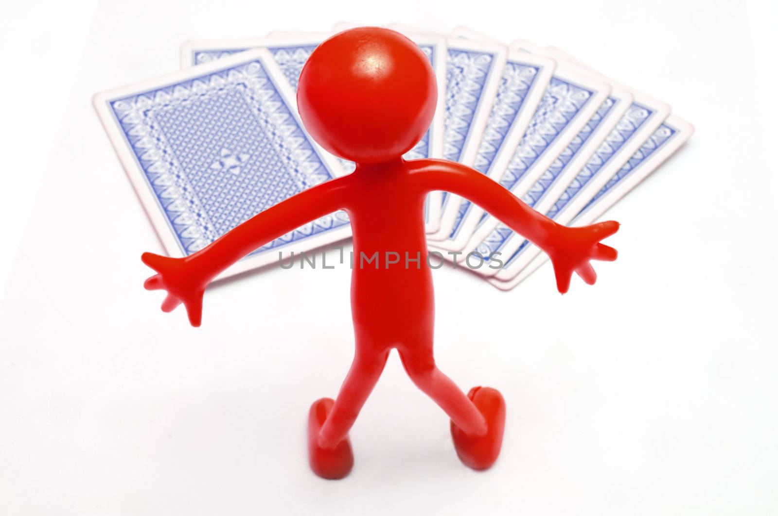 Playing cards and red human figure  