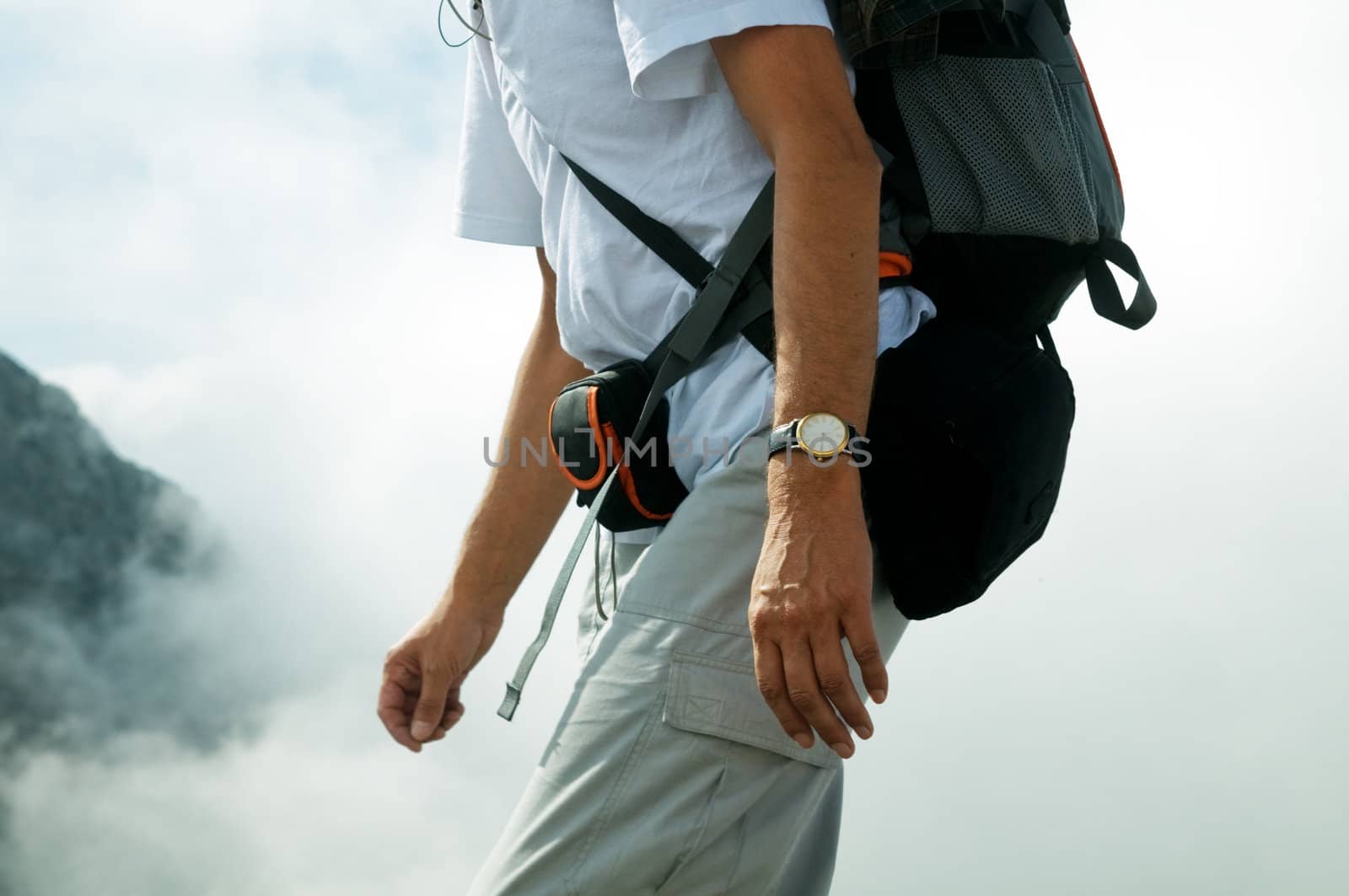 Active tourist in mountains. Body close-up