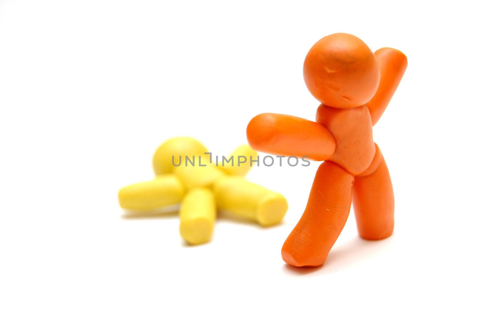 Plasticine figure staying with winner gesture