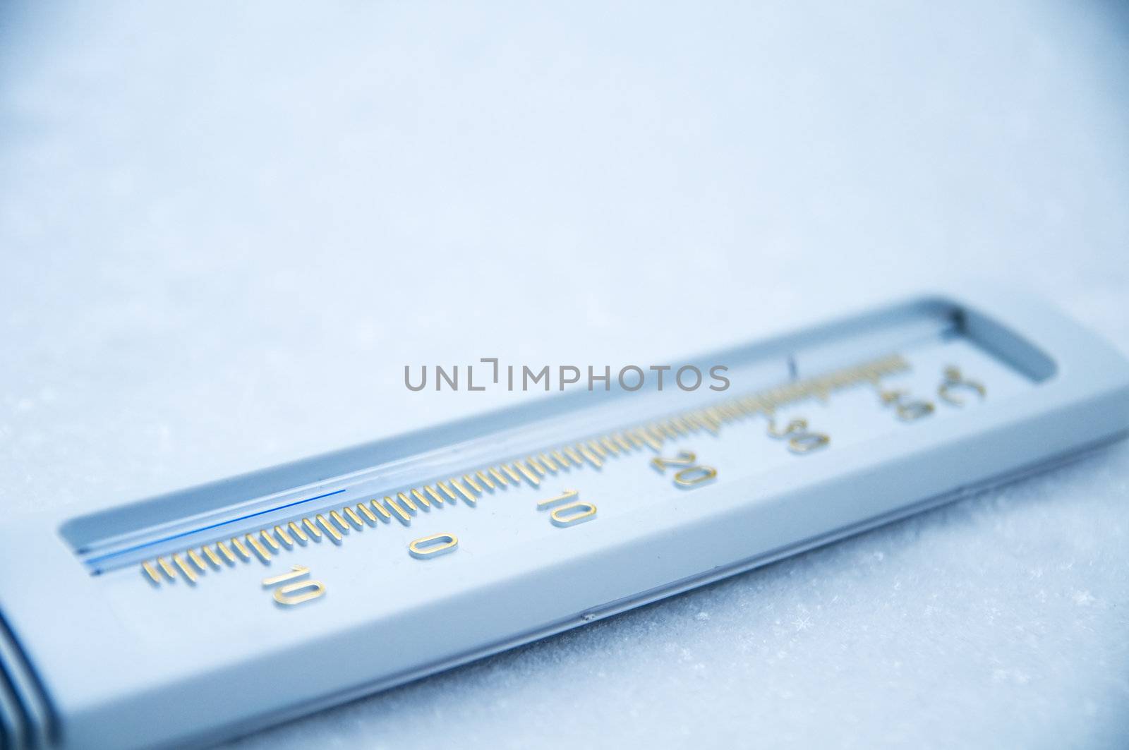 Below zero. Thermometer indicating minus temperature in cold winter.