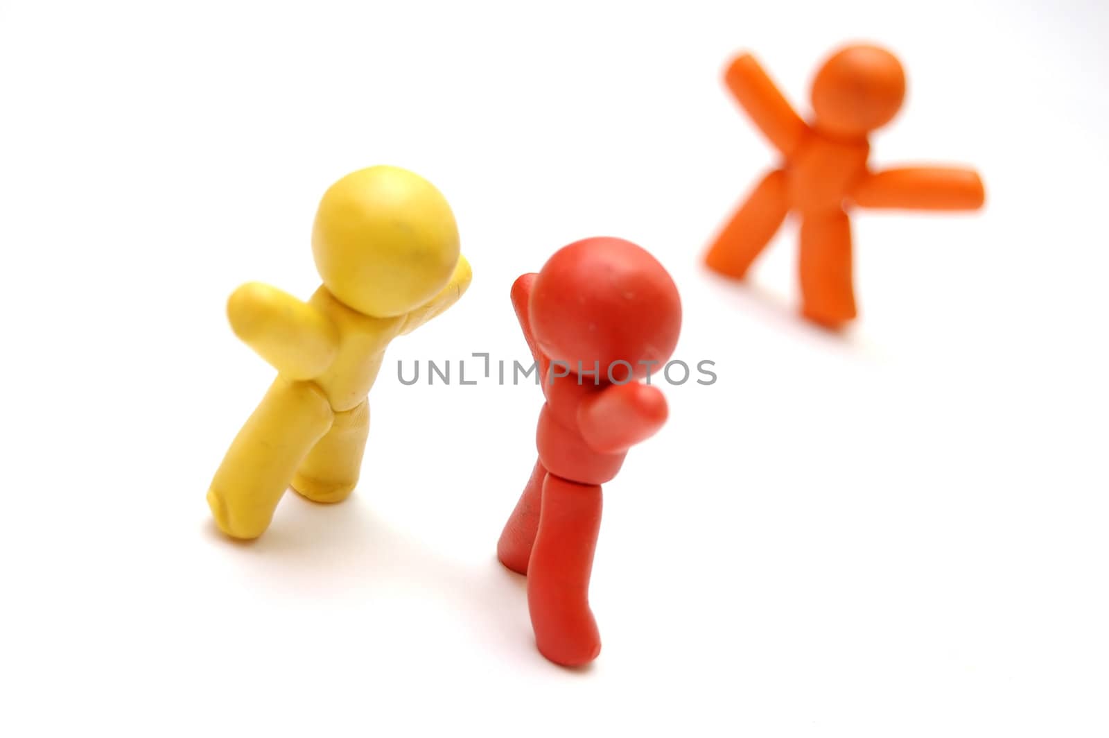 3 plasticine figures. Spreading rumours concept