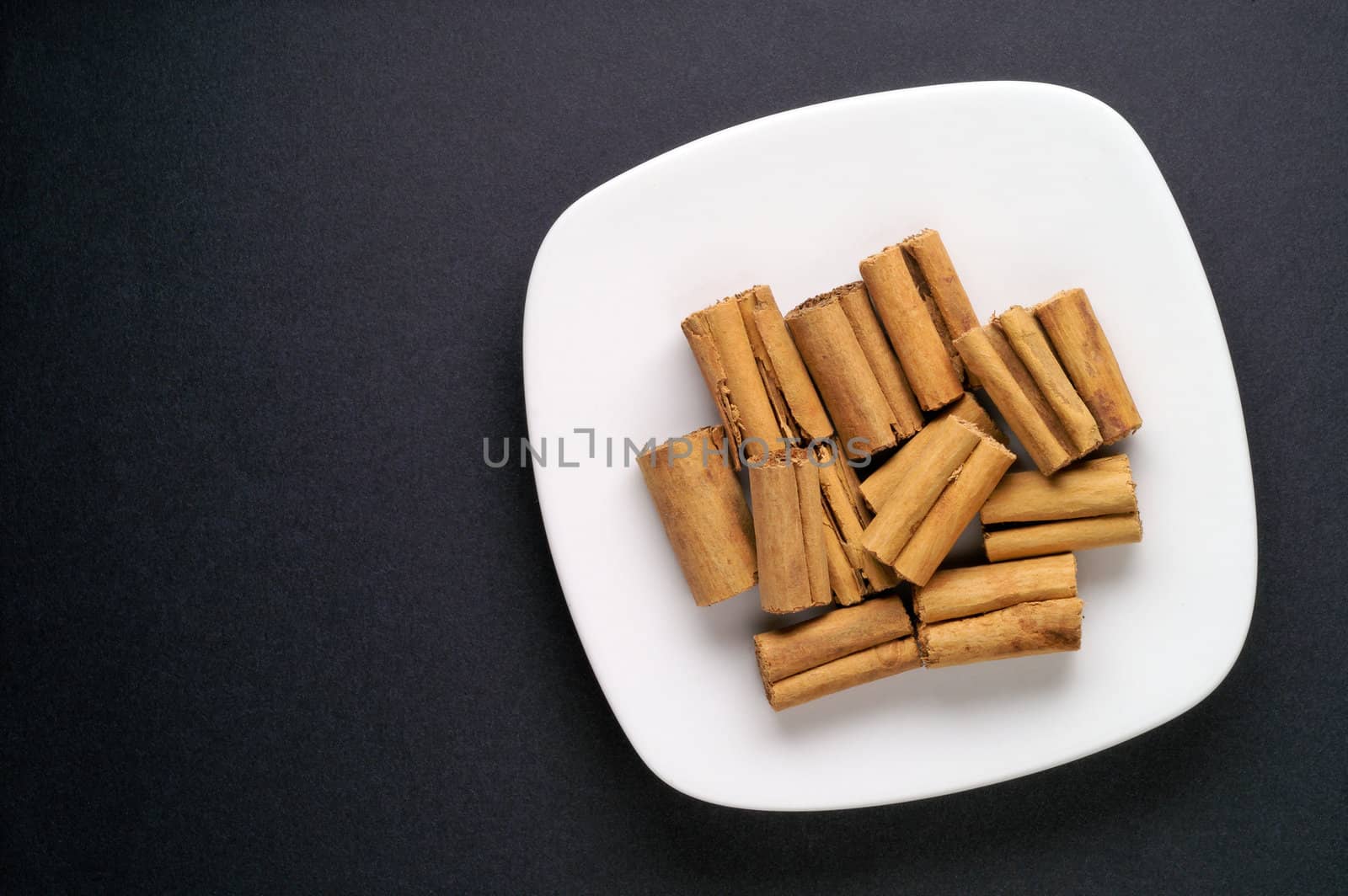 Cinnamon in a dish by Laborer