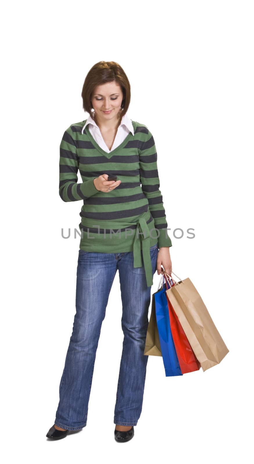 Woman with shopping bags checking her mobile phone.