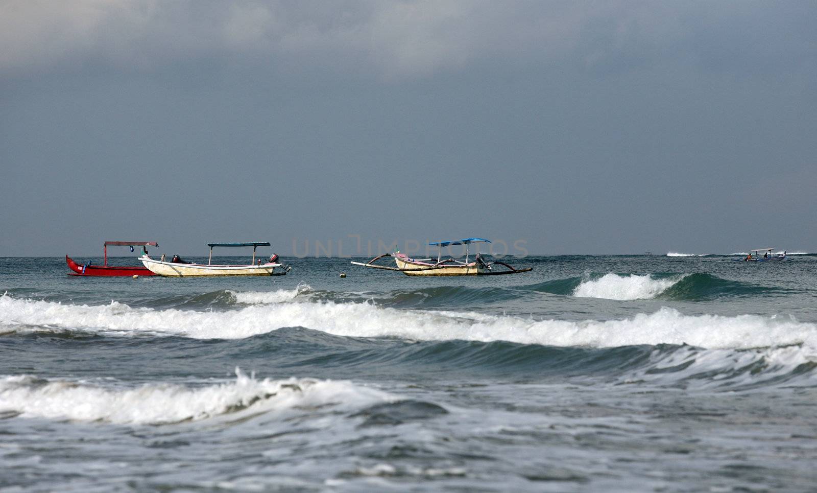 Three  boats anchored in the water
