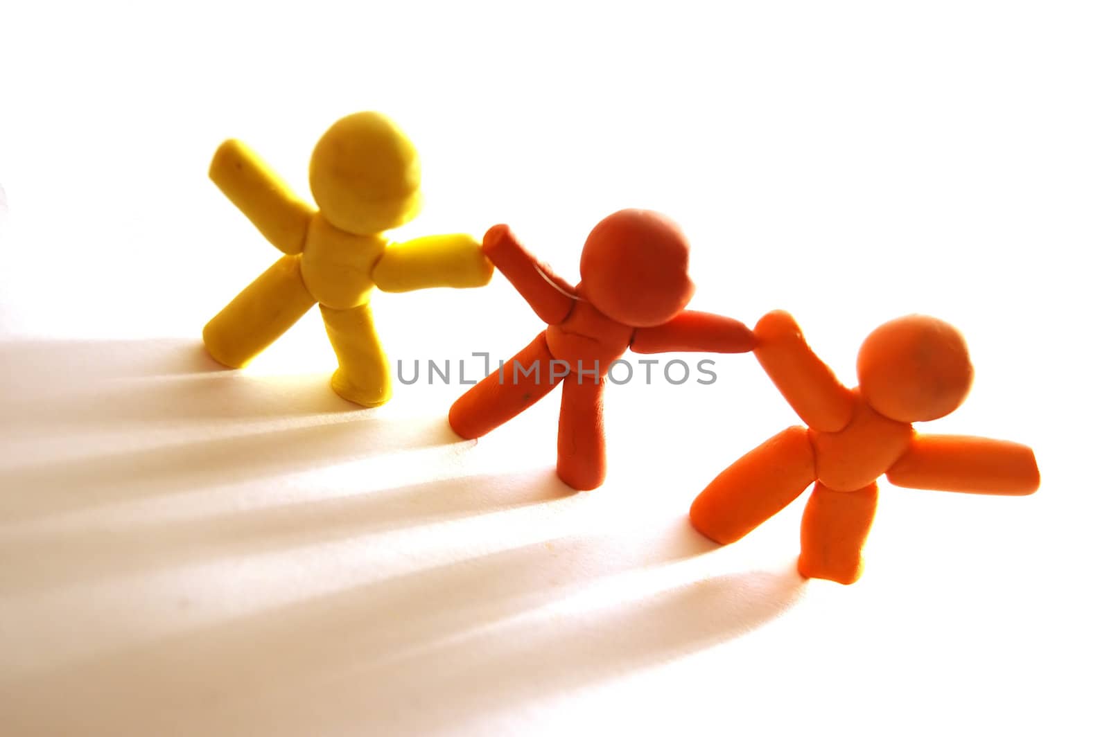 3 plasticine figures staying together and celebrating