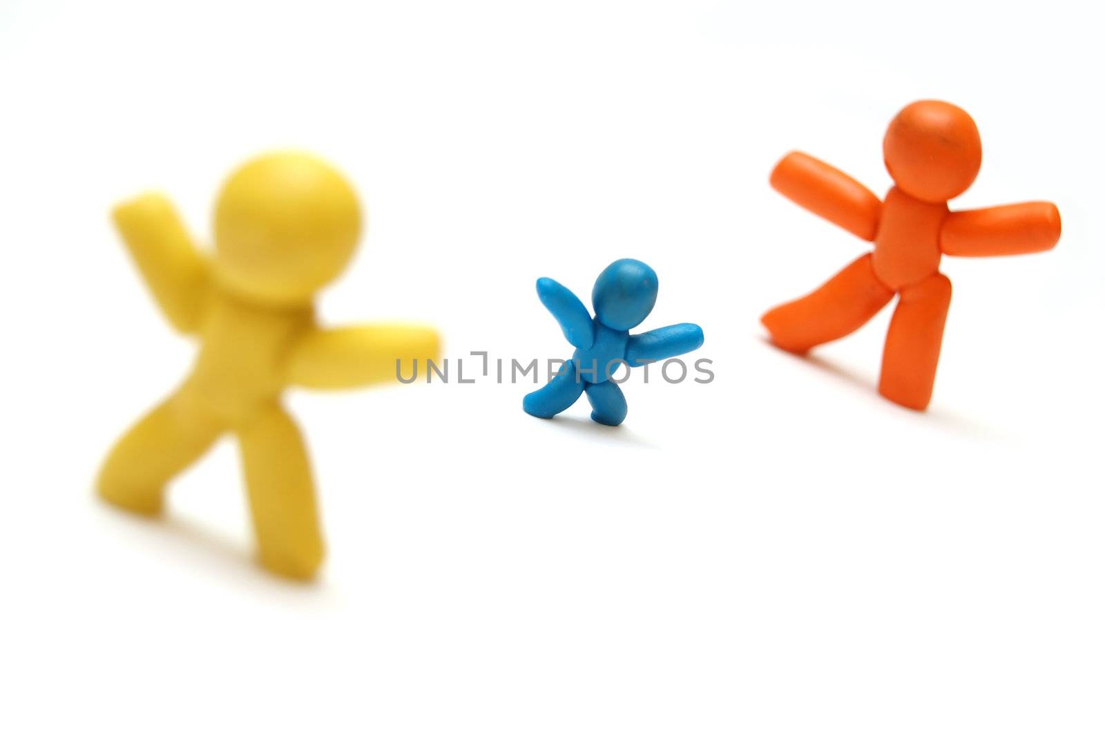 2 plasticine figures staying in front of each other. Competition for child concept