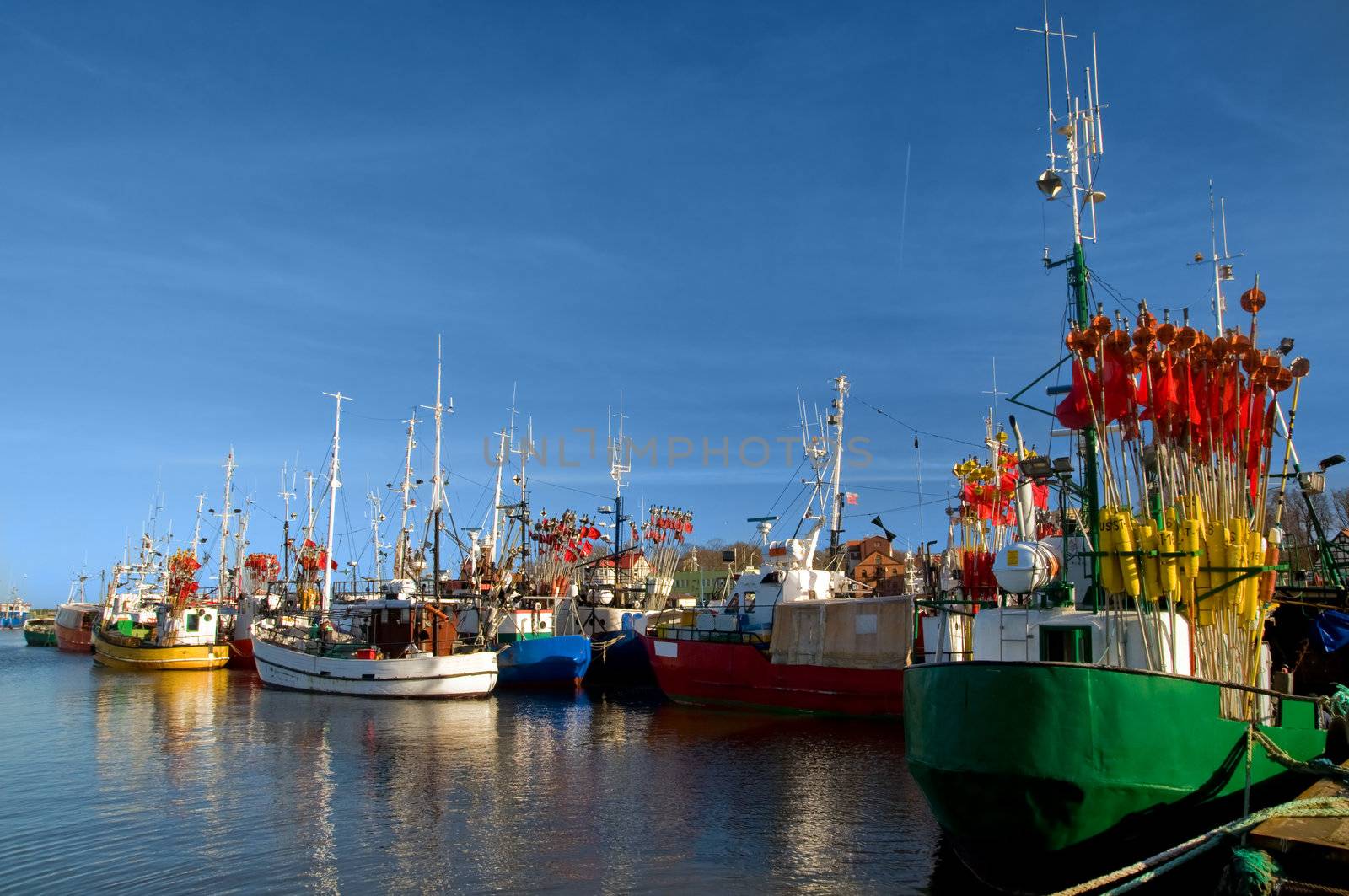 Small ships in a charming harbor, port.