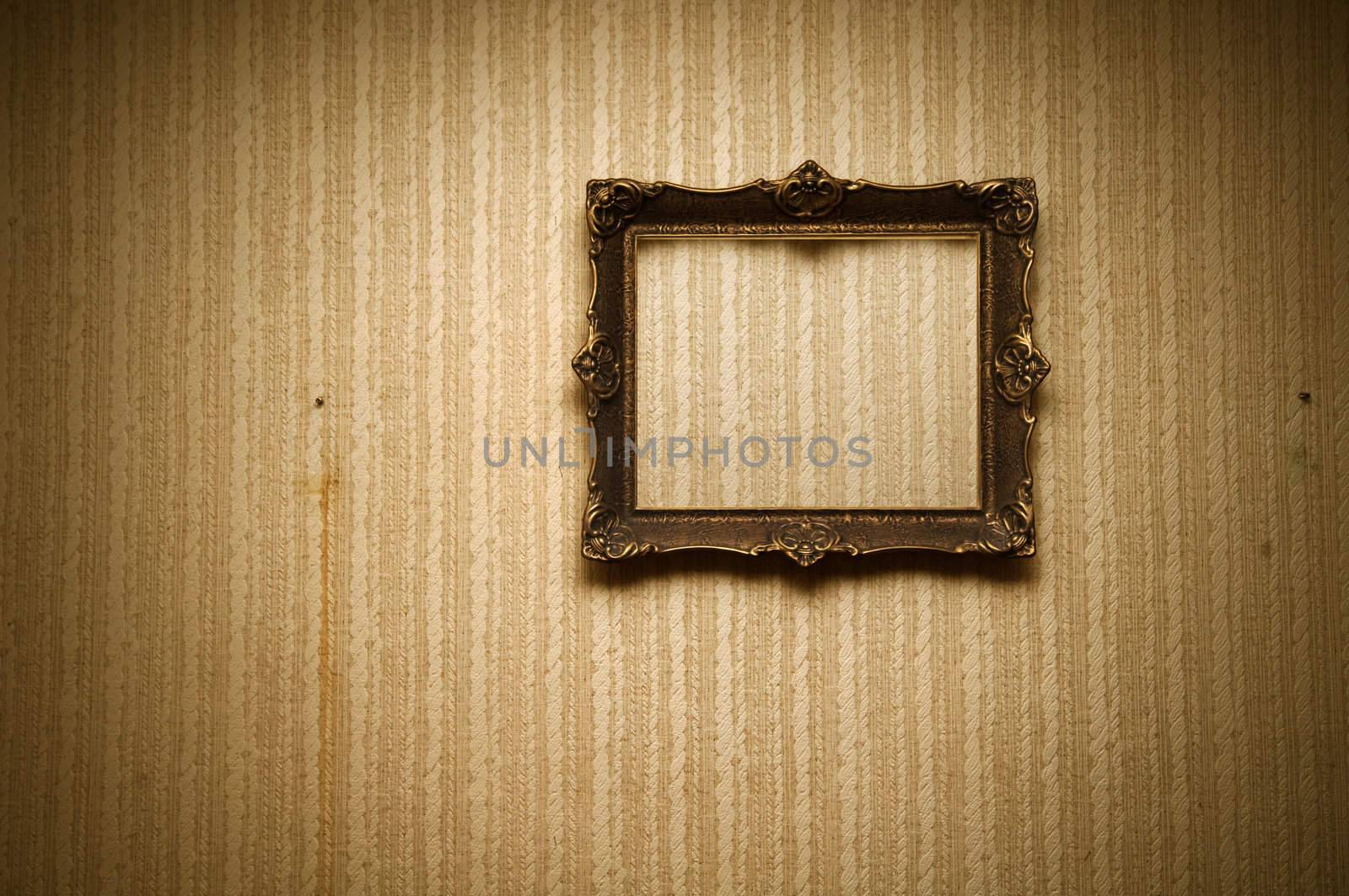 Old ornamented frame on retro grunge wall