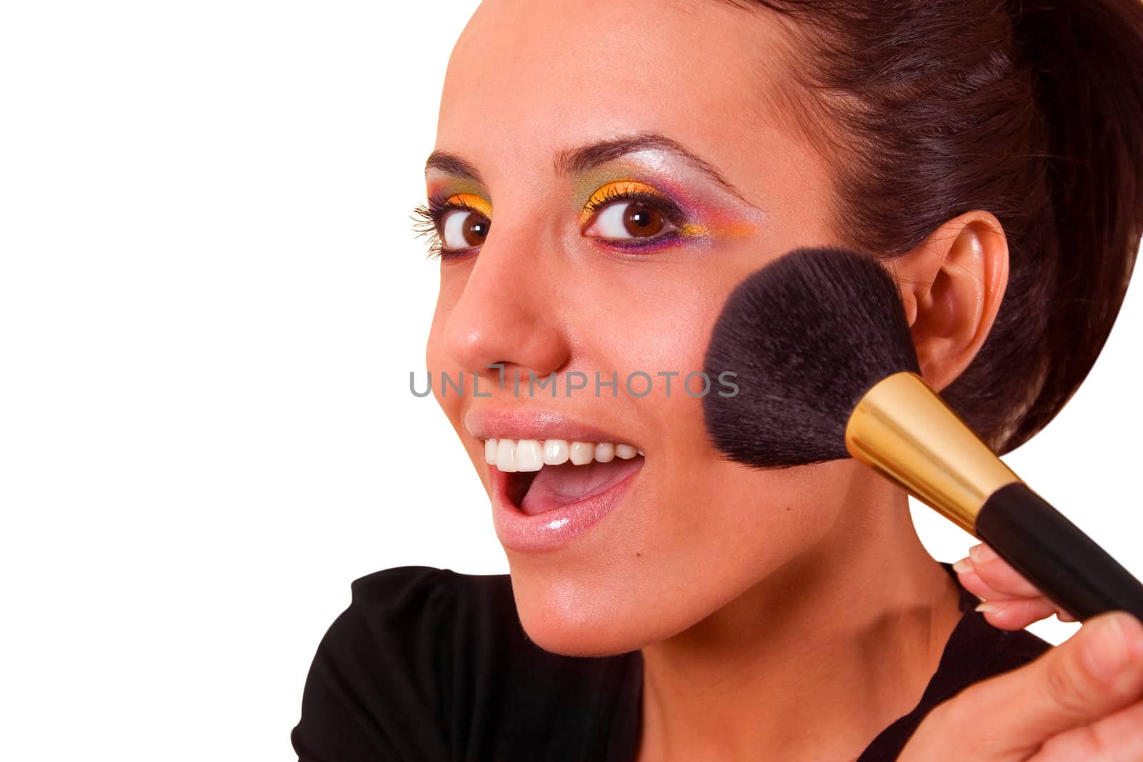 Beauty makeup, woman smiling closeup. Beautiful young woman applying foundation powder or blush with makeup brush. Isolated on white background.