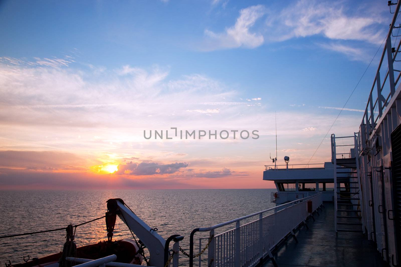 Ship deck, board view. Ocean, sea at sunset
