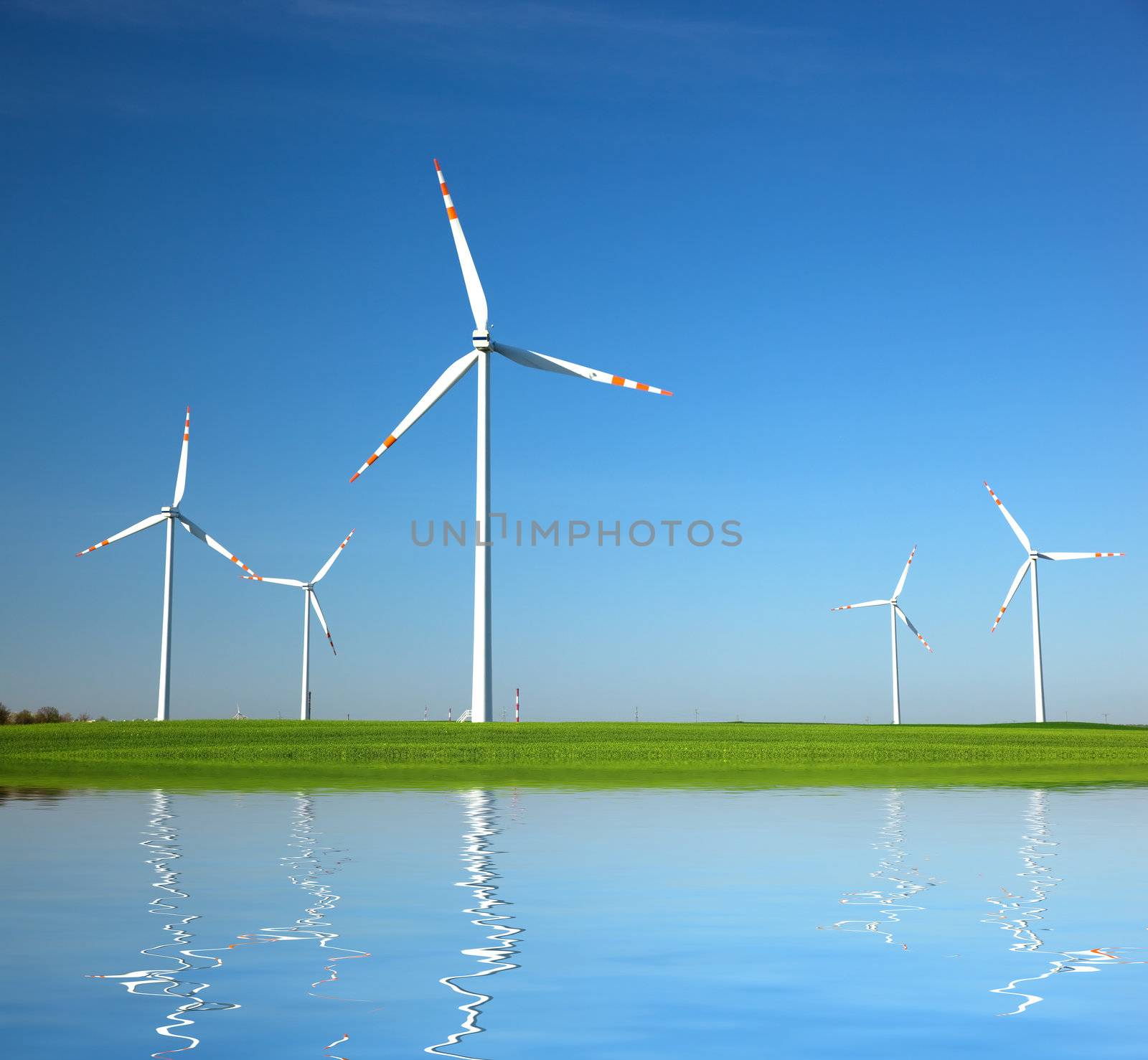 Wind Turbines on green field. Alternative energy, environment concept