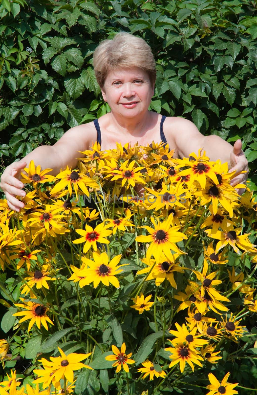 Senior woman with flowers