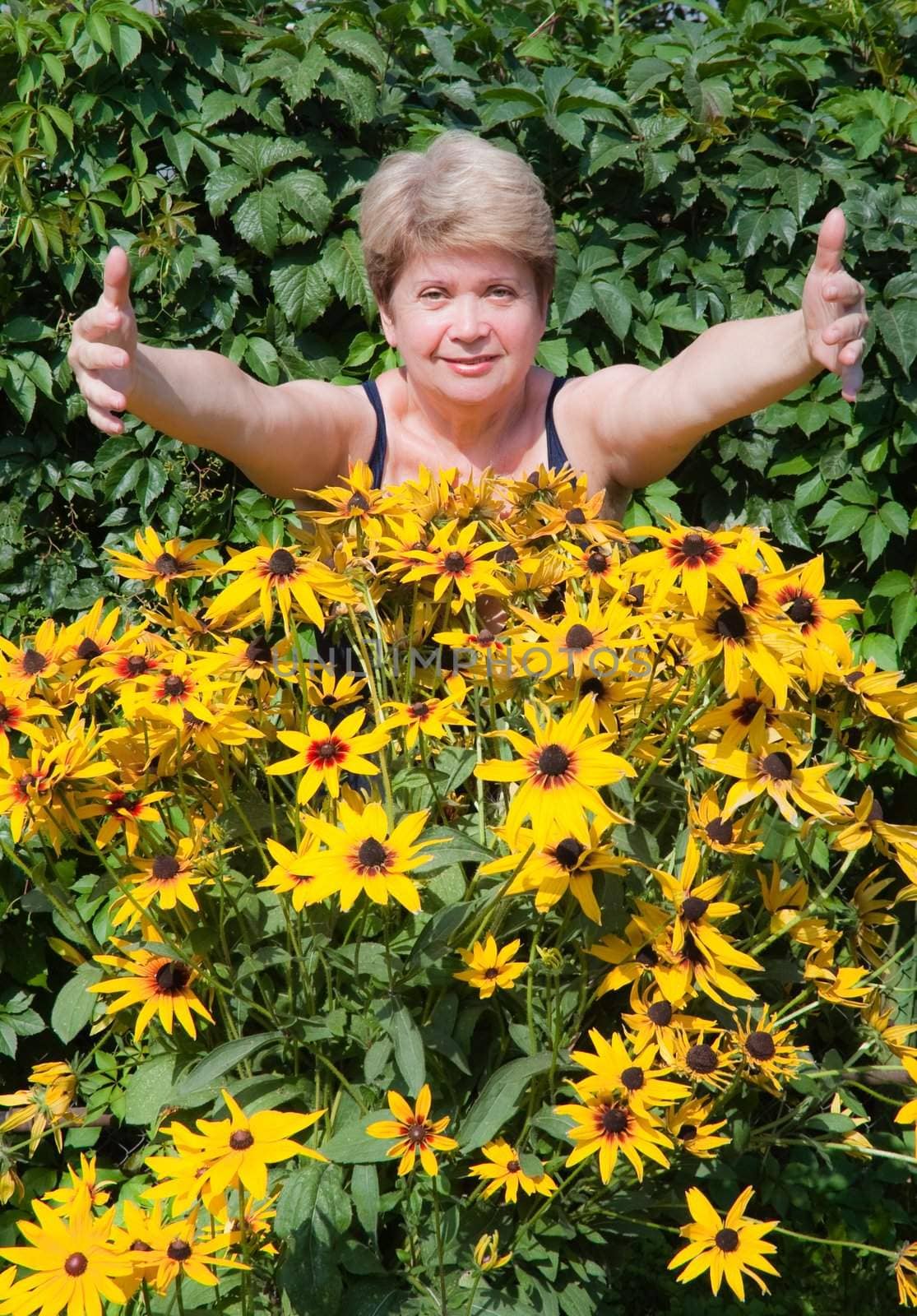 Senior woman with flowers