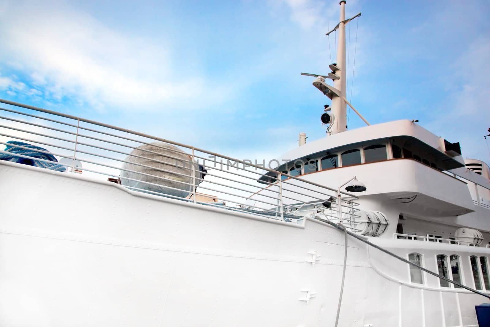 White tourist, luxury ship close up on blue sky