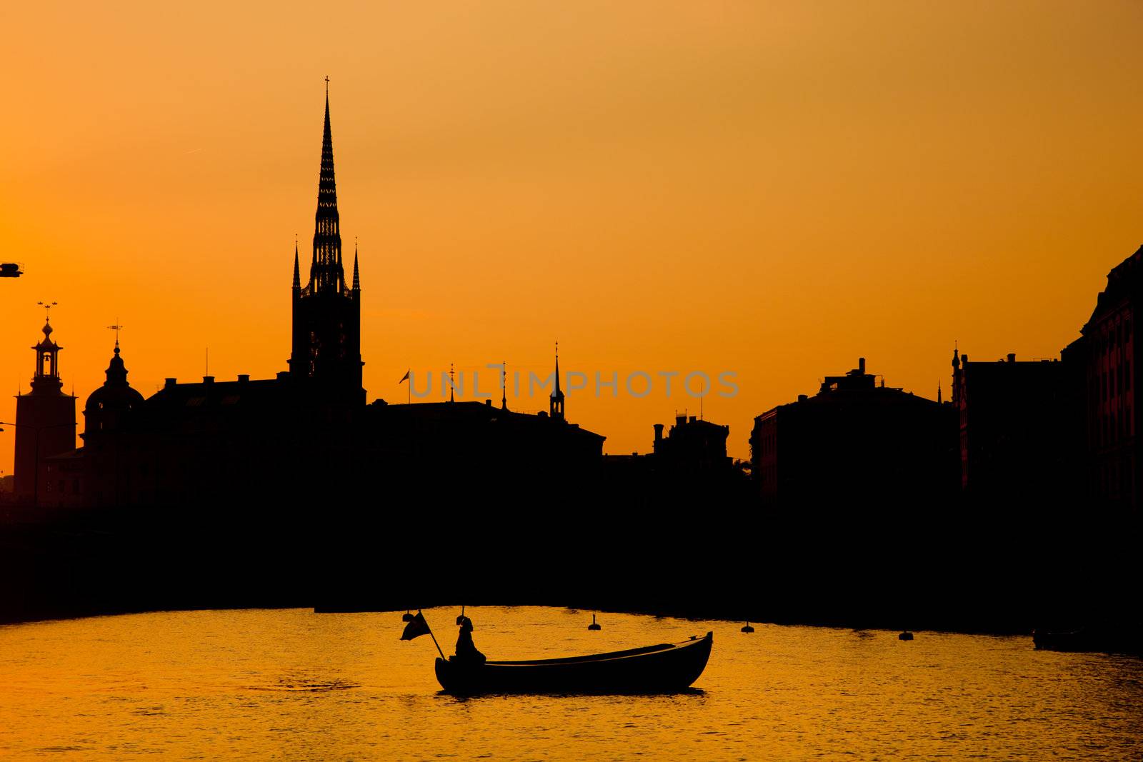 Romantic city of Stockholm, Sweden at sunset. Boat and architecture