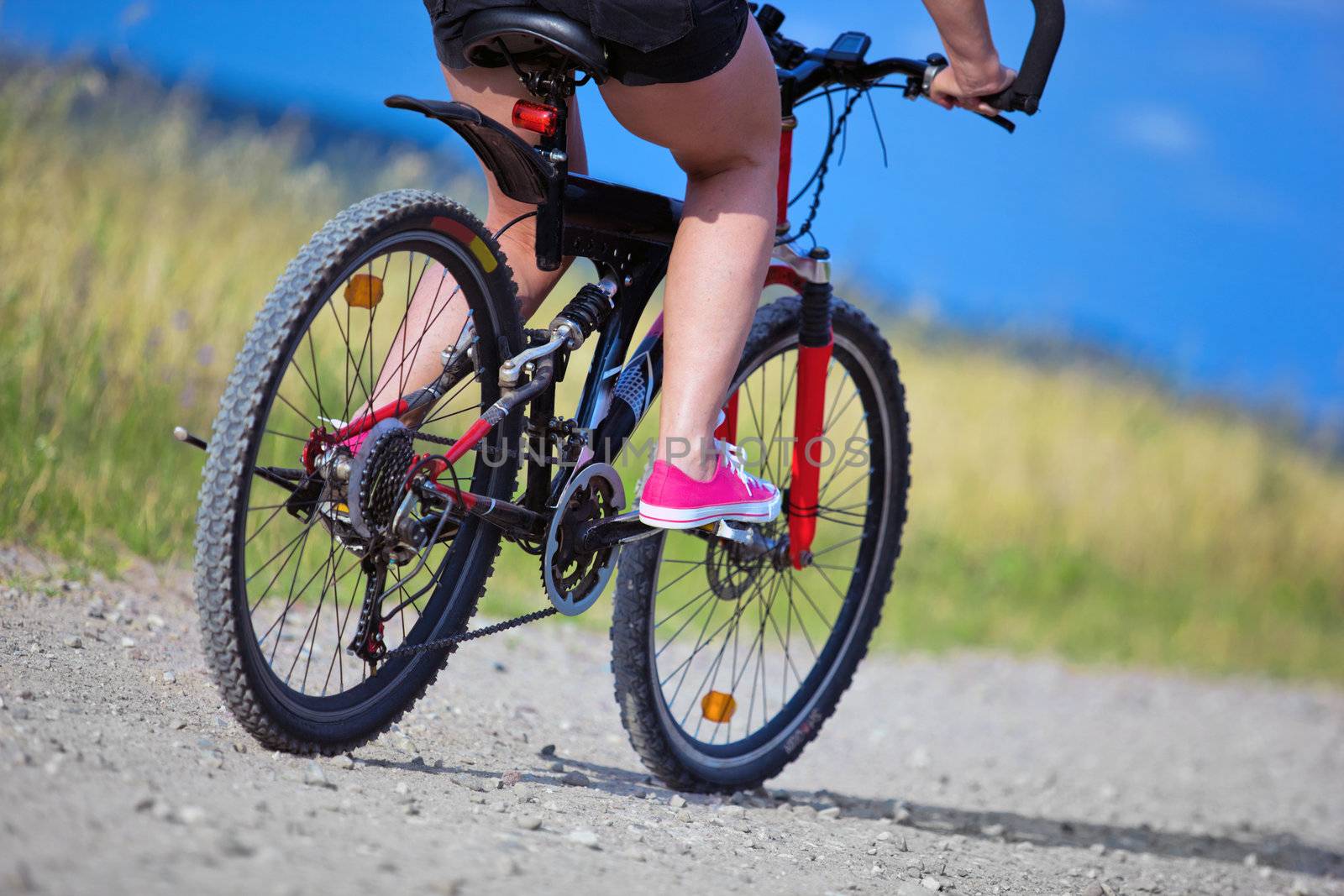 Active woman on a bike trip during summer