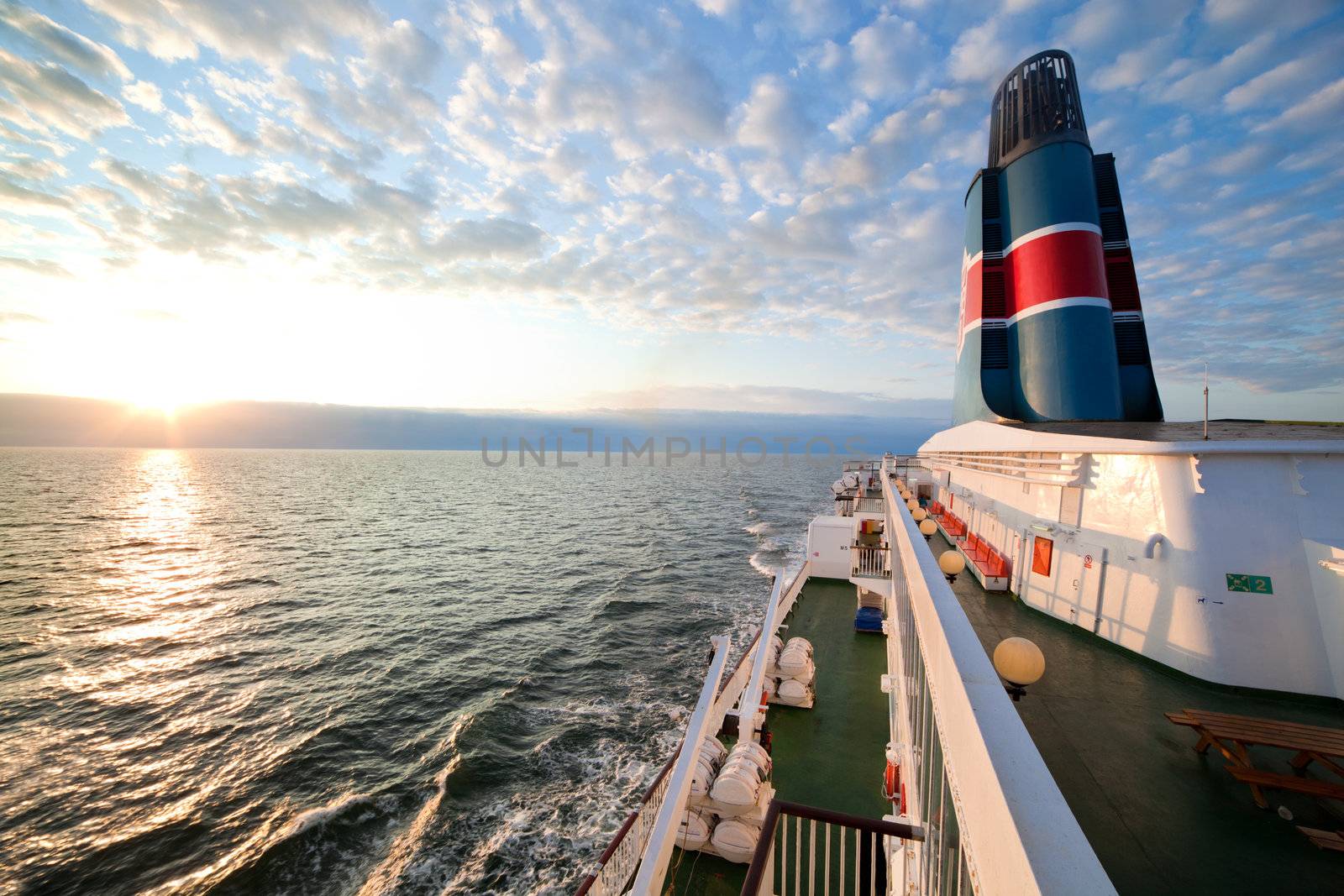 Ship deck, board view. Ocean, sea at sunset