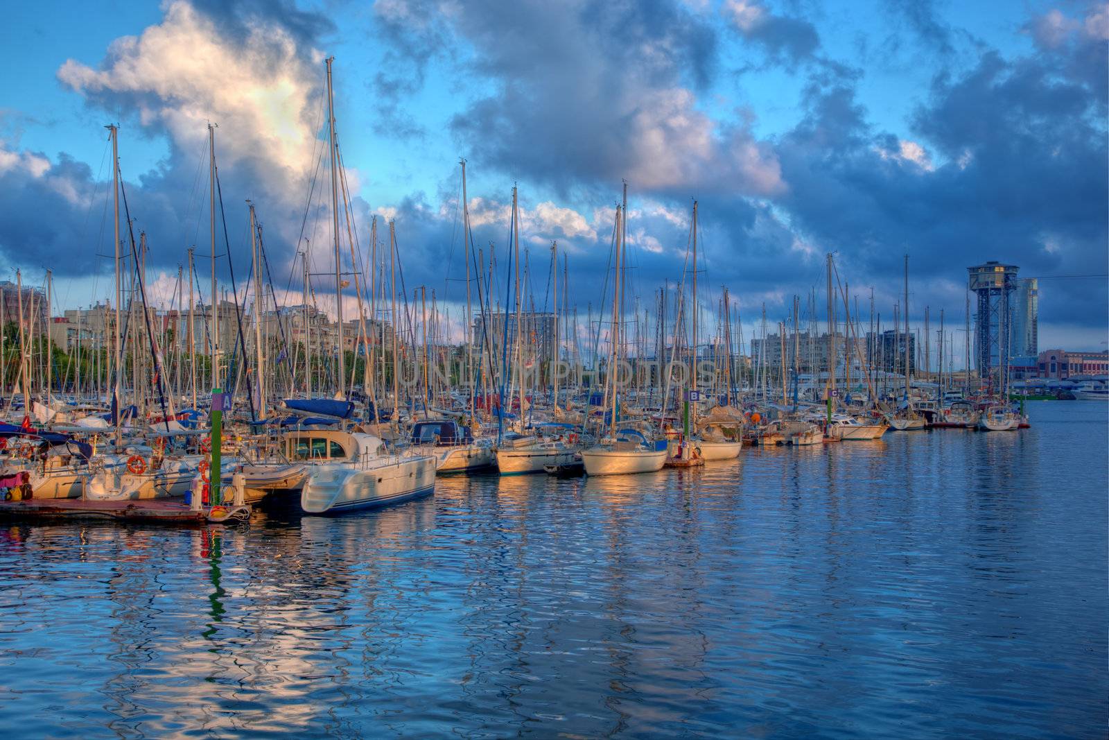 Boats in the harbor of Barcelona, Spain at sunset