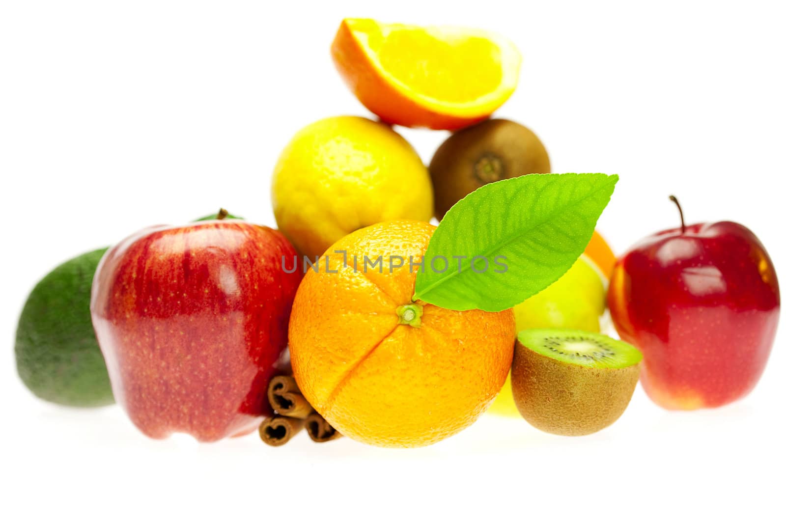 kiwi, avocado, apples, orange, lemon, and cinnamon, isolated on white
