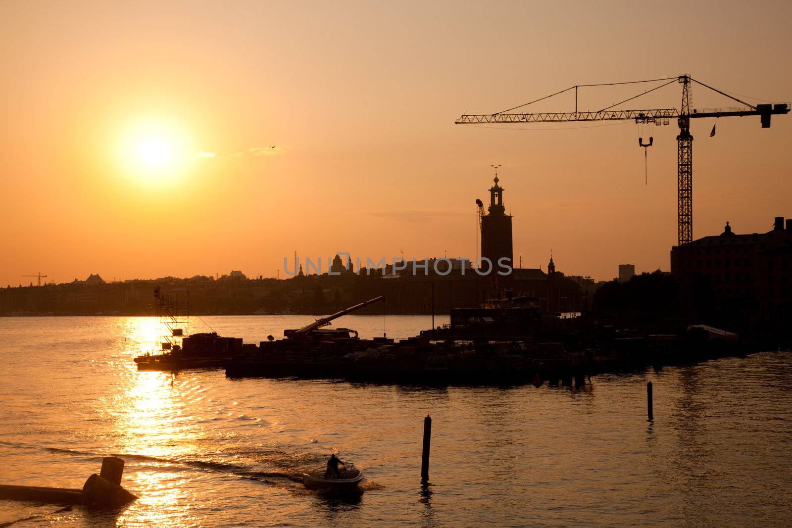 Industrial harbor, port at sunset and a crane